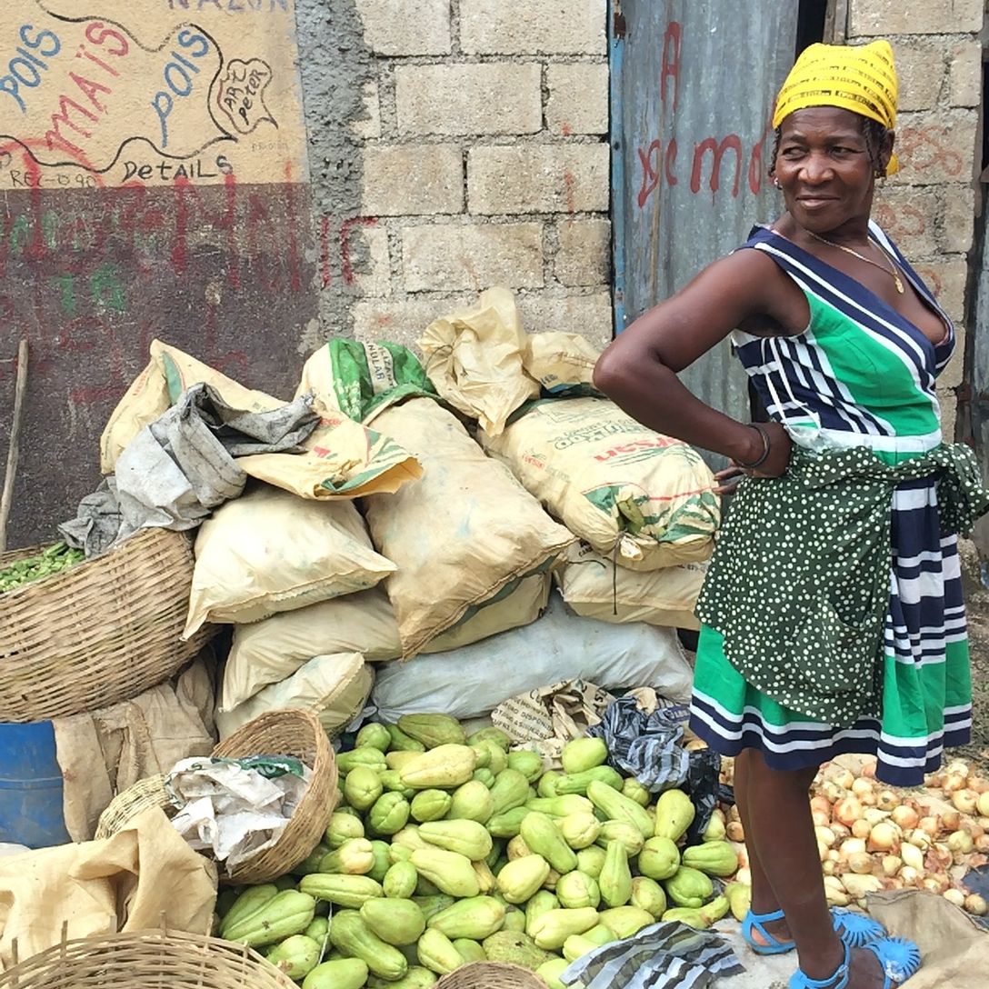 Haitian market woman standing in market area